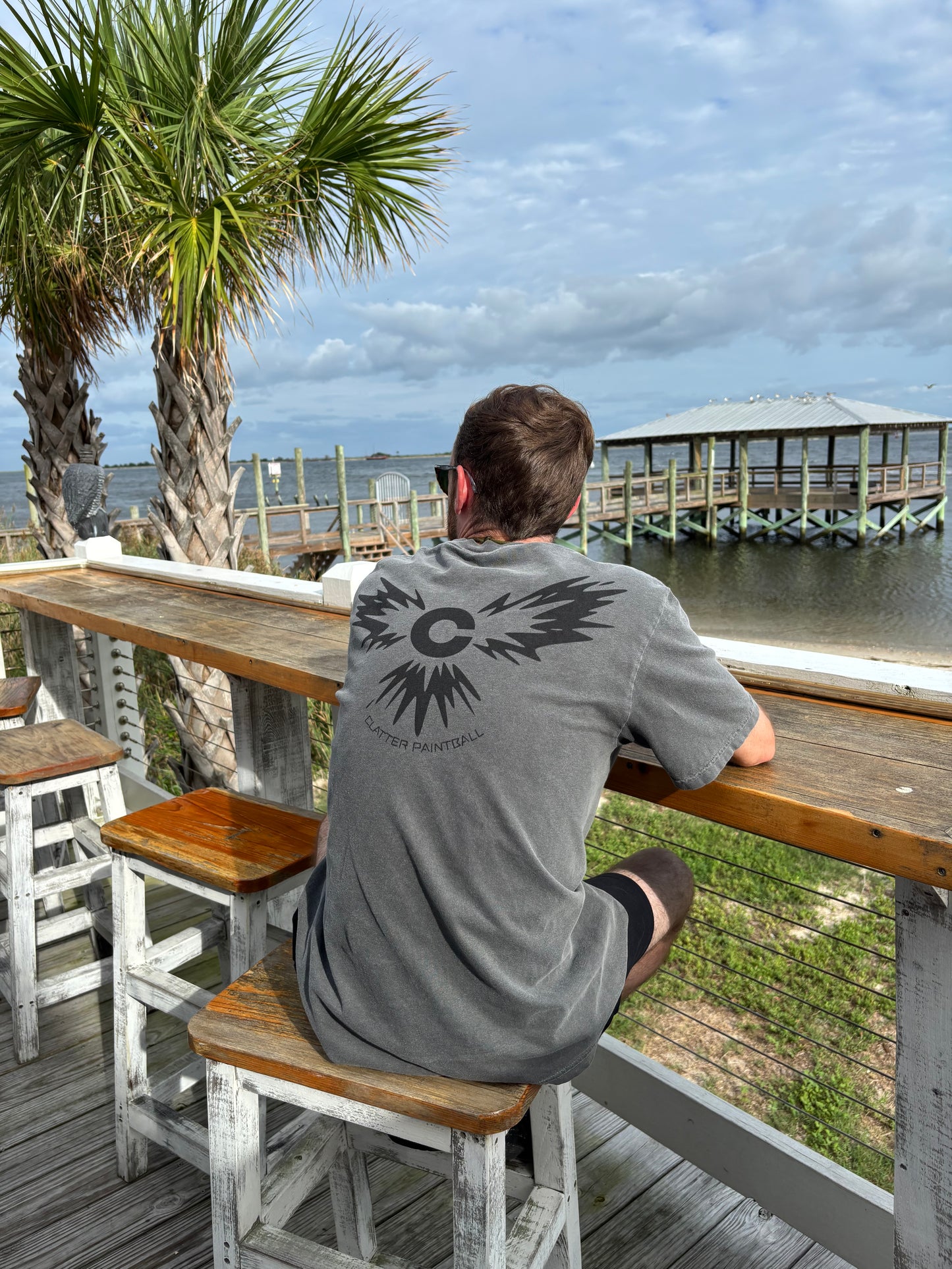 Model wearing shirt looking at beach